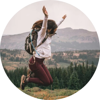 A man jumps high against a starry night, representing the courage to overcome limitations and discover his full potential.